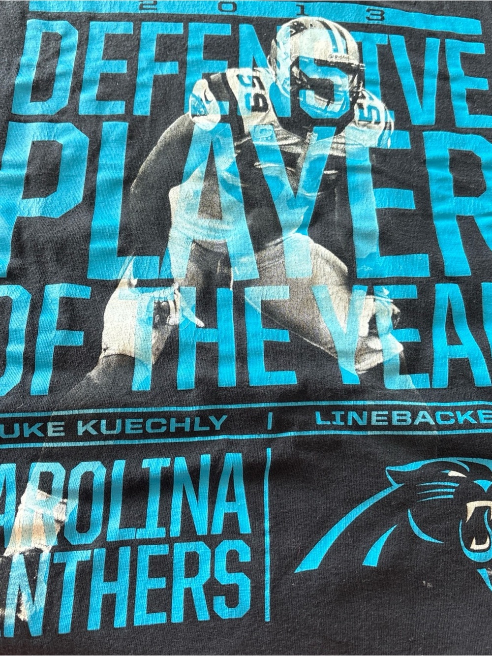 Nike Carolina Panthers Teal and Black Defensive Player Graphic Tee